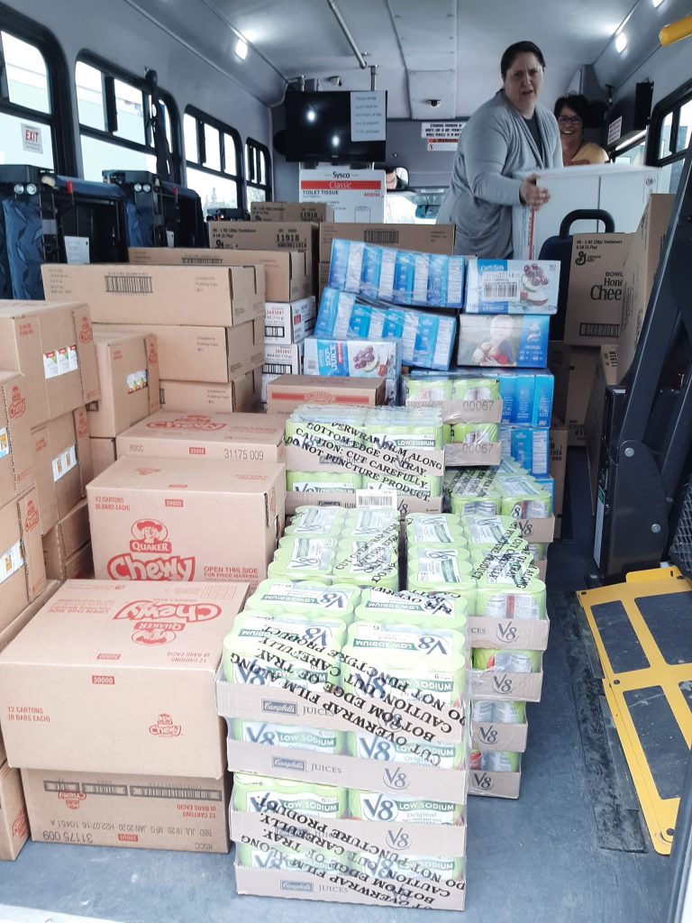 White Earth Transit drivers organize food for a food drive