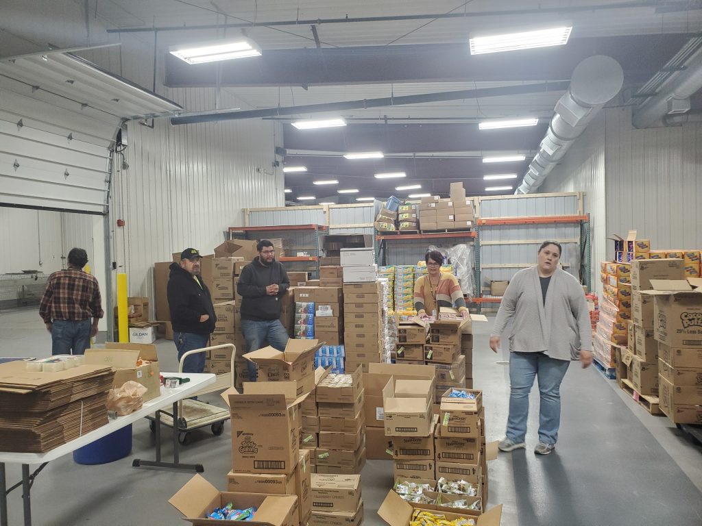 White Earth Transit drivers organize food for a food drive